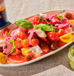 HEIRLOOM TOMATO SALAD WITH BUFFALO MOZZARELLA & CASHEW PESTO 